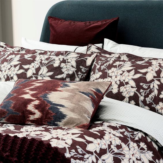 Aris Ikat Bolster Cushion by Bedeck of Belfast in Mulberry Red